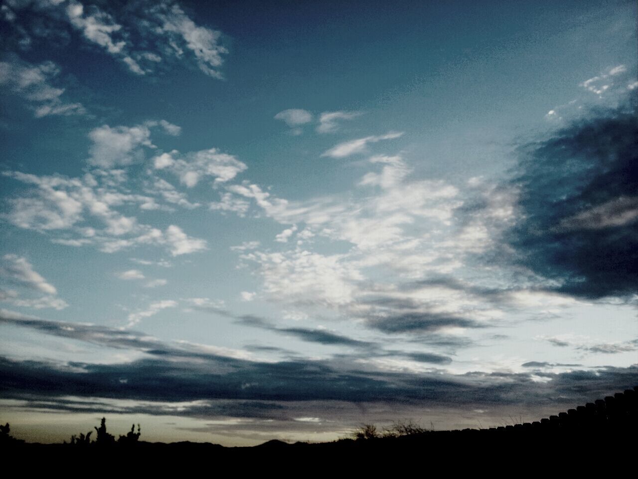 silhouette, sky, tranquility, tranquil scene, scenics, beauty in nature, cloud - sky, nature, sunset, cloud, low angle view, landscape, cloudy, tree, dusk, idyllic, outdoors, cloudscape, no people, outline