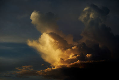 Low angle view of storm clouds in sky during sunset