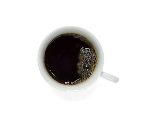 Directly above shot of black coffee against white background