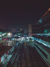 High angle view of railroad tracks at night