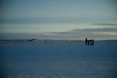 Scenic view of sea against sky during winter