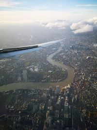 Aerial view of city and buildings against sky