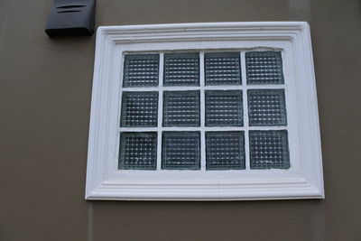 Close-up of window on white wall