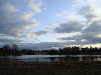 Scenic view of landscape against cloudy sky