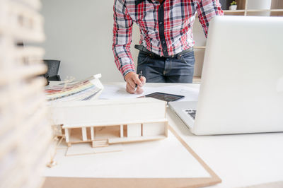 Man using laptop on table