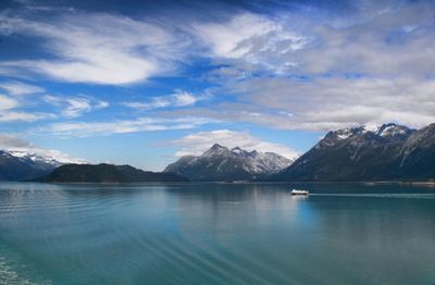 Scenic view of lake and mountains against sky