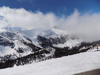 Scenic view of snowcapped mountains against sky