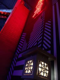 Low angle view of illuminated lights in building