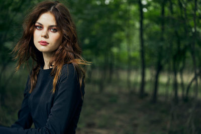 Portrait of woman in forest