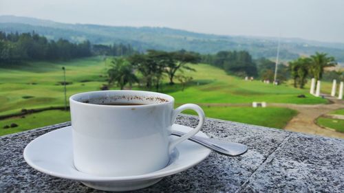 Close-up of coffee cup on table