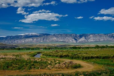 Scenic view of mountains against cloudy sky