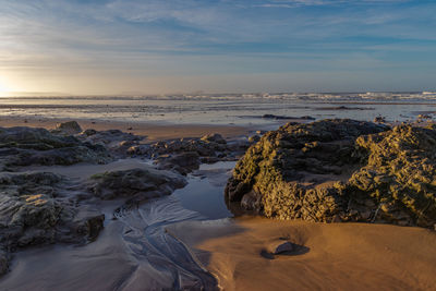 Scenic view of sea against sky during sunset