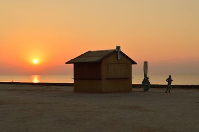 Scenic view of sea against romantic sky at sunset