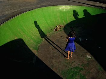 Rear view of woman standing in water