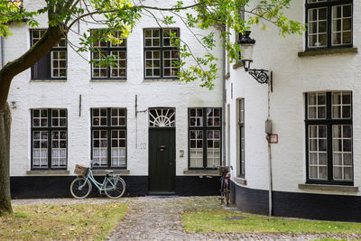 Bicycle outside house against building