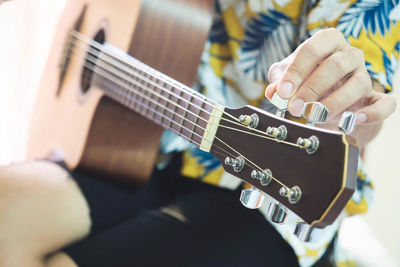 Close-up of playing guitar