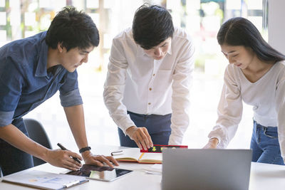 Group of people working on table