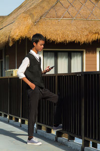 Low angle view of man standing against sky