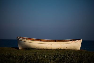 View of boat of cliff by the beach