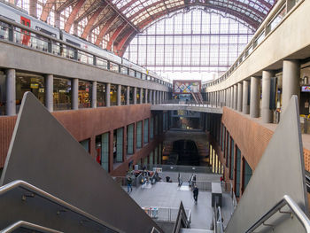 High angle view of people in modern railway building