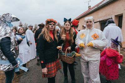 People standing in front of traditional building