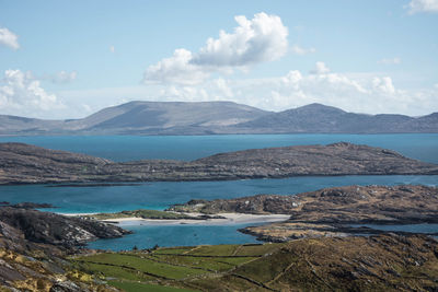 Calm lake against mountain range