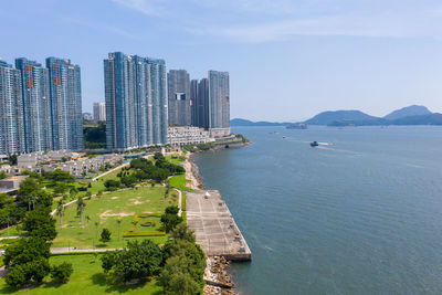 Panoramic view of sea and buildings against sky