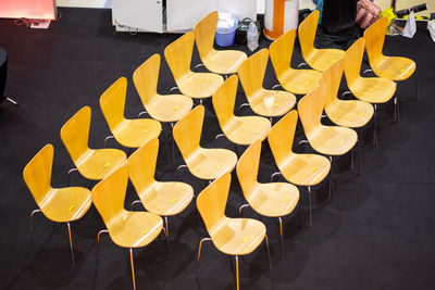 High angle view of chairs on table