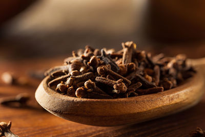 Close-up of roasted coffee beans on table