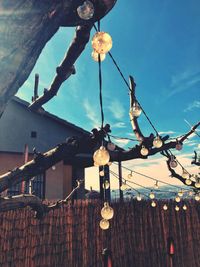 Low angle view of illuminated lanterns against sky