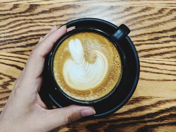 High angle view of coffee cup on table