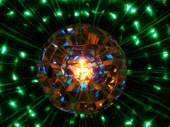 Low angle view of illuminated lights hanging from ceiling