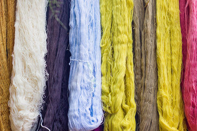 Full frame shot of multi colored threads for sale at market stall
