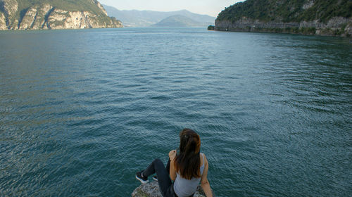 Rear view of woman looking at sea