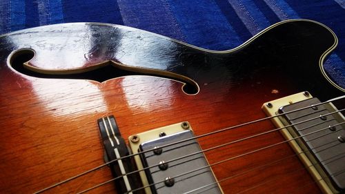 High angle view of guitar on table