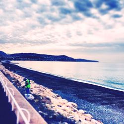 Scenic view of sea against cloudy sky