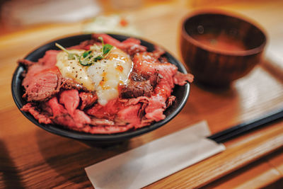High angle view of meat in plate on table
