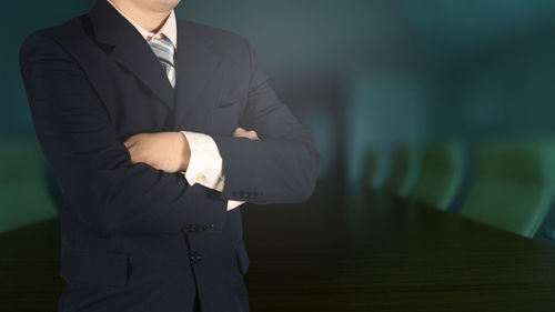 Midsection of man standing at home