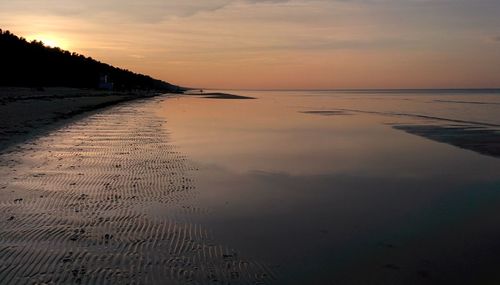 Scenic view of sea against sky at sunset