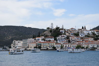 Townscape by sea against sky