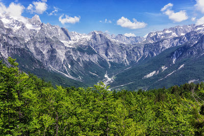 Scenic view of landscape and mountains against sky