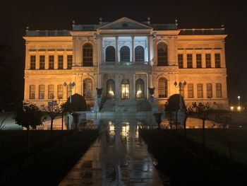 Reflection of building in water at night