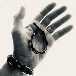 Close-up of human hand against white background