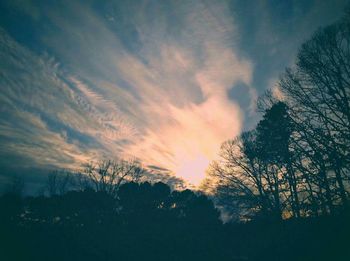 Scenic view of landscape against sky at sunset