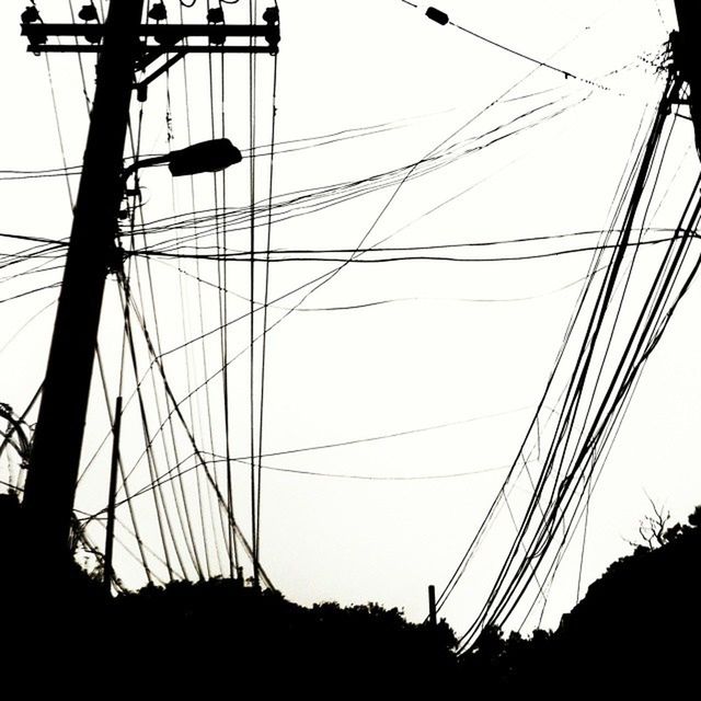 power line, electricity pylon, power supply, electricity, cable, connection, low angle view, technology, silhouette, fuel and power generation, sky, clear sky, power cable, transportation, telephone pole, outdoors, telephone line, dusk, electricity tower, complexity