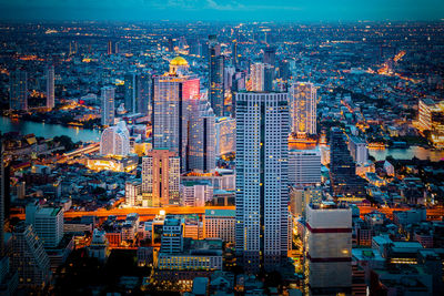 High angle view of illuminated buildings in city against sky