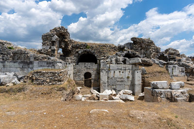 Old ruin building against cloudy sky