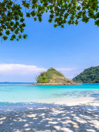 Scenic view of sea against blue sky