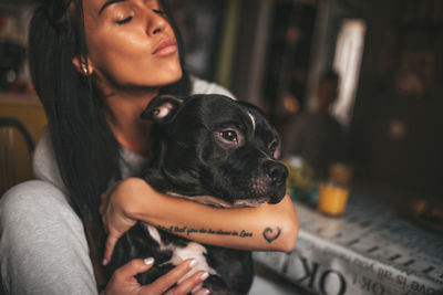 Close-up portrait of woman with dog