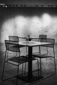 Rear view of man sitting on chair